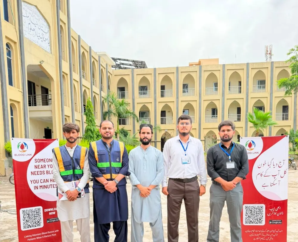 Blood Link team with campaign banners promoting voluntary blood donation